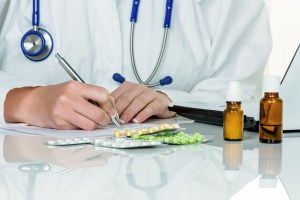 doctor prescribes a drug